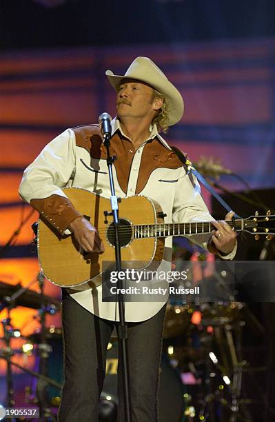Singer Alan Jackson performs at the 2003 CMT Flameworthy Video Music Awards in the Gaylord Entertainment Center April 7, 2003 in Nashville, Tennessee.