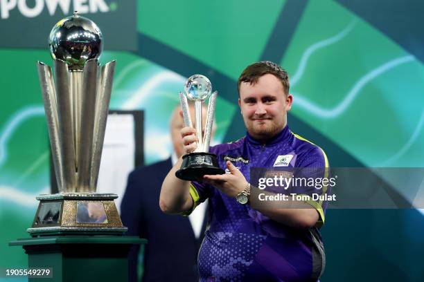 Runner-up Luke Littler of England celebrates with the runner-up trophy after the 2023/24 Paddy Power World Darts Championship Final between Luke...