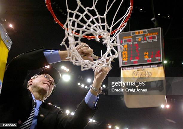 Head coach Jim Boeheim of Syracuse cuts down the net after he and his team defeated Kansas 81-78 during the championship game of the NCAA Men's Final...