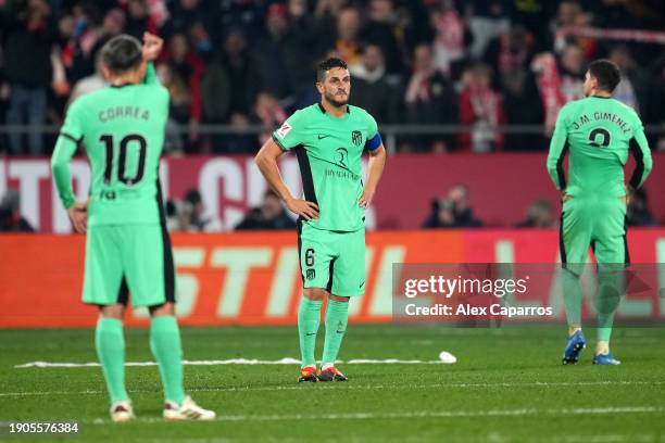 Koke of Atletico Madrid looks dejected after conceding the team's fourth goal which was scored by Ivan Martin of Girona FC during the LaLiga EA...