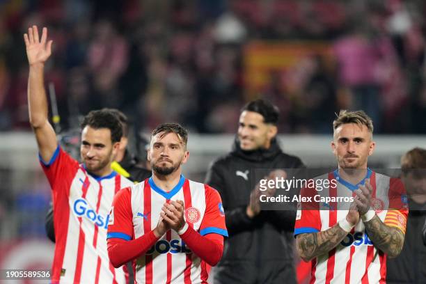 Portu and Aleix Garcia of Girona FC celebrate following the team's victory in the LaLiga EA Sports match between Girona FC and Atletico Madrid at...