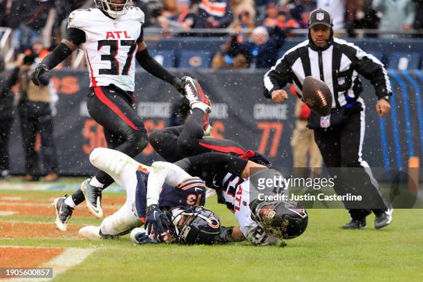 Mike Hughes of the Atlanta Falcons breaks up a pass intended for Tyler Scott of the Chicago Bears at Soldier Field on December 31, 2023 in Chicago,...