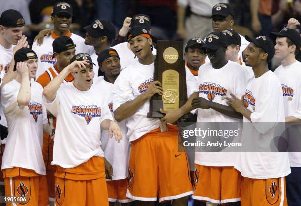 Carmelo Anthony and the rest of the Syracuse team celebrate with the championship trophy after defeating Kansas 81-78 during the championship game of...