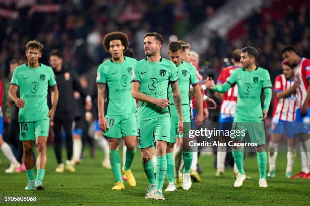 Atletico de Madrid players look dejected following their defeat during the LaLiga EA Sports match between Girona FC and Atletico de Madrid at...