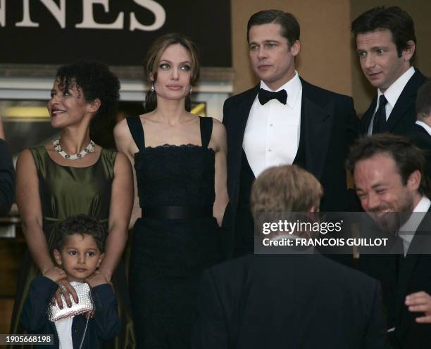 French journalist and writer Mariane Pearl and her son Adam, US actress Angelina Jolie, actor and producer Brad Pitt and actor Dan Futterman pose 21...