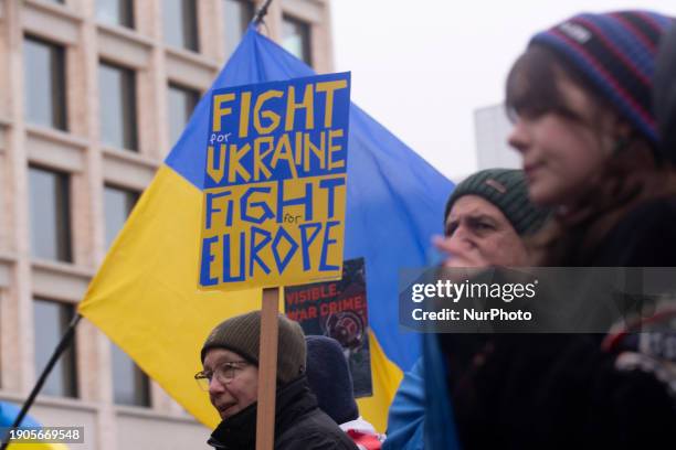 Hundreds of people are participating in a demonstration showing support for Ukraine, where a 100-meter-long Ukrainian flag is being carried, in...
