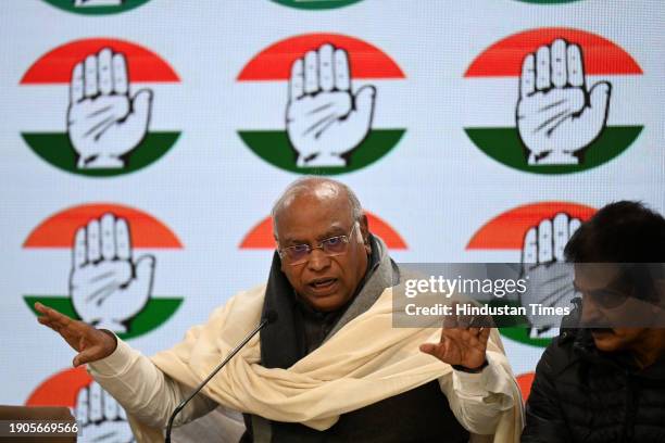 Congress President Mallikarjun Kharge, along with Congress leaders Jairam Ramesh and KC Venugopal, during the launch of the logo and slogan for...