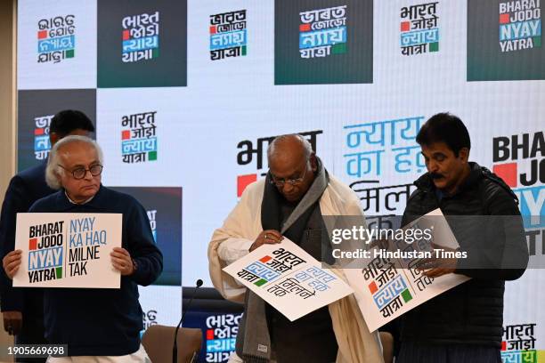 Congress President Mallikarjun Kharge, along with Congress leaders Jairam Ramesh and KC Venugopal, during the launch of the logo and slogan for...