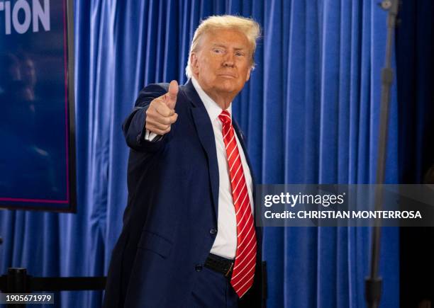 Former US President and 2024 presidential hopeful Donald Trump greets his supporters at a "Commit to Caucus" rally in Newton, Iowa on January 6, 2024.