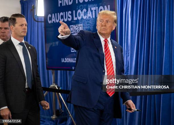 Former US President and 2024 presidential hopeful Donald Trump greets his supporters at a "Commit to Caucus" rally in Newton, Iowa on January 6, 2024.