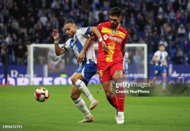 Martin Braithwaite and Omar Alderete are competing during the match between RCD Espanyol and Getafe CF, which corresponds to the 1/16 final of the...