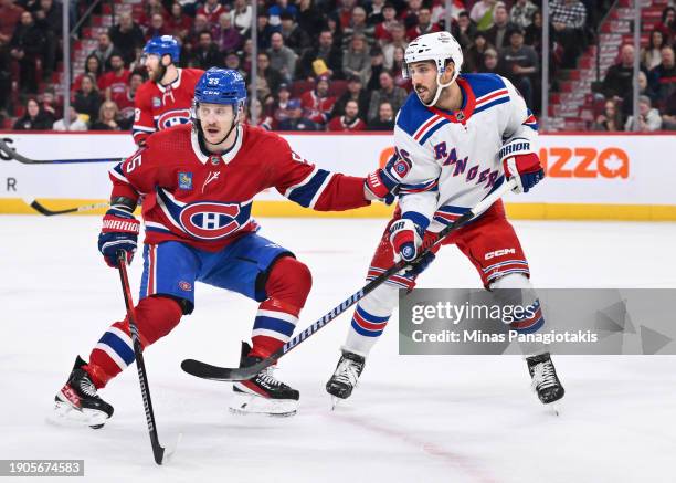 Michael Pezzetta of the Montreal Canadiens and Vincent Trocheck of the New York Rangers skate against each other during the first period at the Bell...