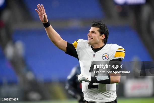 Steelers quarterback Mason Rudolph smiles and waves to fans as he runs off the field after the Pittsburgh Steelers versus Baltimore Ravens NFL game...