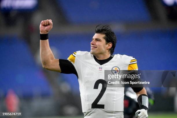 Steelers quarterback Mason Rudolph smiles and pumps his fist as he runs off the field after the Pittsburgh Steelers versus Baltimore Ravens NFL game...