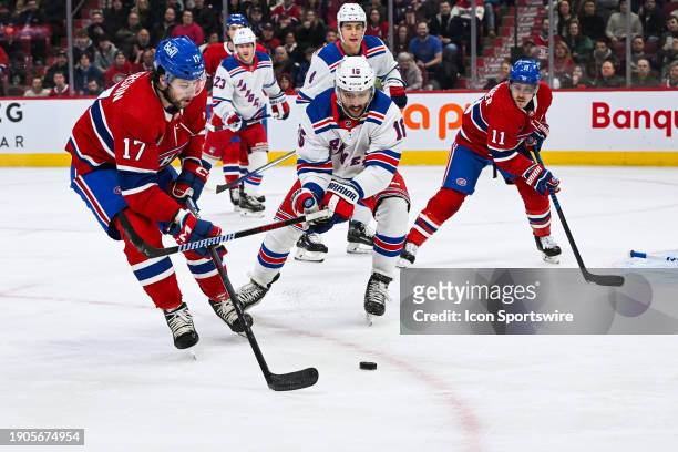 New York Rangers center Vincent Trocheck defends the puck against Montreal Canadiens right wing Josh Anderson during the New York Rangers versus the...