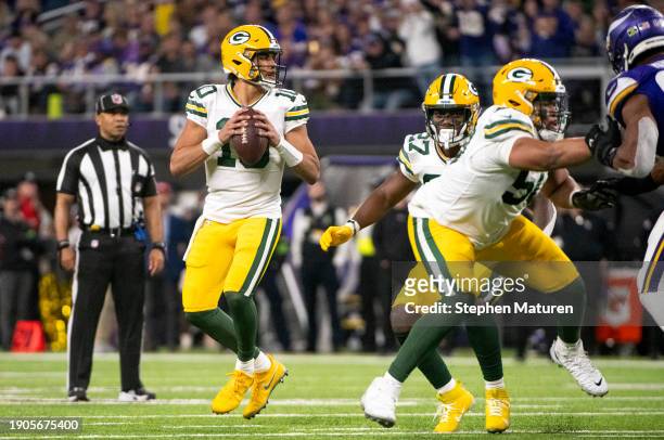 Jordan Love of the Green Bay Packers looks to pass the ball in the fourth quarter of the game against the Minnesota Vikings at U.S. Bank Stadium on...