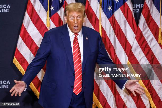 Former US President and Republican presidential hopeful Donald Trump arrives for a "Commit to Caucus" rally in Clinton, Iowa, on January 6, 2024.