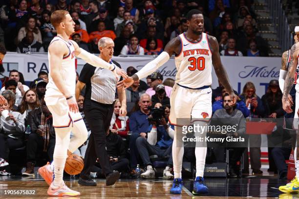 Donte Divincenzo of the New York Knicks high fives Julius Randle of the New York Knicks during the game against the Washington Wizards on January 6,...