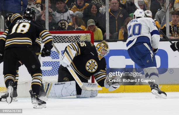 Linus Ullmark of the Boston Bruins makes a glove save against the Tampa Bay Lightning during the third period at the TD Garden on January 6, 2024 in...