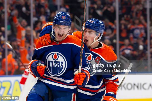 Zach Hyman and Ryan Nugent-Hopkins of the Edmonton Oilers celebrate a goal against the Ottawa Senators during the third period at Rogers Place on...