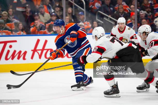 Zach Hyman of the Edmonton Oilers skates against Thomas Chabot of the Ottawa Senators during the third period at Rogers Place on January 6, 2024 in...