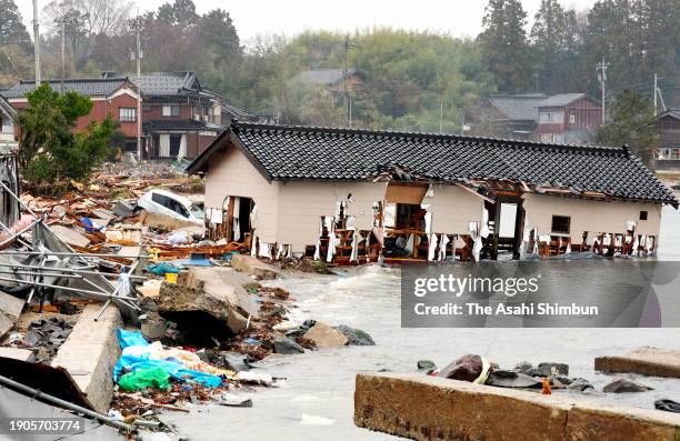 Collapsed house is washed away into the sea after hit by tsunami two days after multiple strong earthquakes jolted on January 3, 2024 in Noto,...