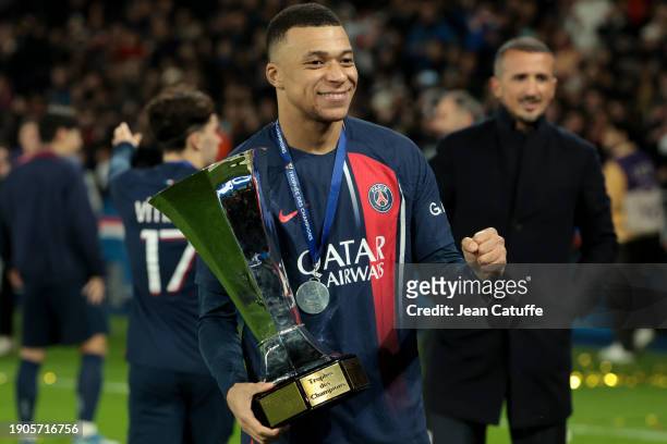 Kylian Mbappe of PSG - holding the trophy - celebrates the victory following the Trophee des Champions between Paris Saint-Germain and Toulouse FC at...