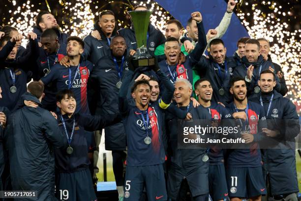 Captain of PSG Marquinhos - holding the trophy - along Lee Kang-in, Lucas Beraldo, Cher Ndour, Ousmane Dembele, Kylian Mbappe, Keylor Navas, Achraf...