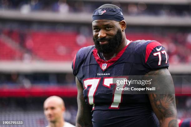 George Fant of the Houston Texans walks off of the field during an NFL football game against the Tennessee Titans at NRG Stadium on December 31, 2023...