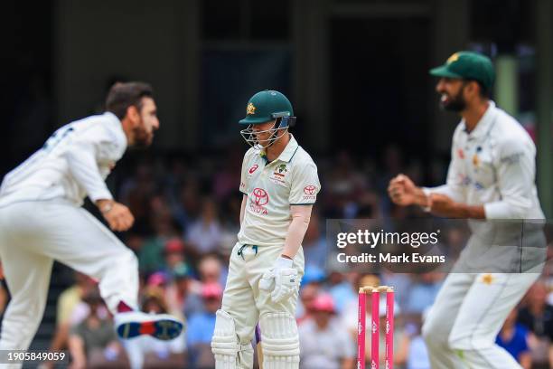 David Warner of Australia reacts after being caught out by Babar Azam of Pakistan off the bowling of Salman Ali Agha of Pakistan during day two of...