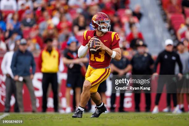 Caleb Williams of the USC Trojans drops back and looks to throw a pass during the first half of a game against the UCLA Bruins at United Airlines...