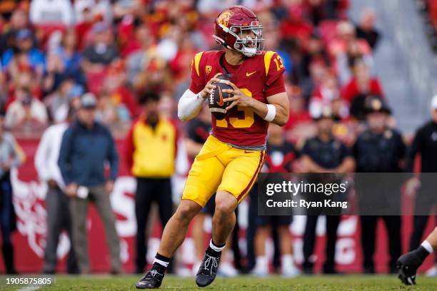 Caleb Williams of the USC Trojans drops back and looks to throw a pass during the first half of a game against the UCLA Bruins at United Airlines...