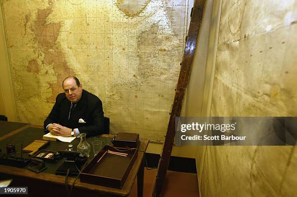 The Hon. Nicholas Soames, the grandson of former British prime minister Sir Winston Churchill, inspects the Chiefs of Staff Conference Room at the...