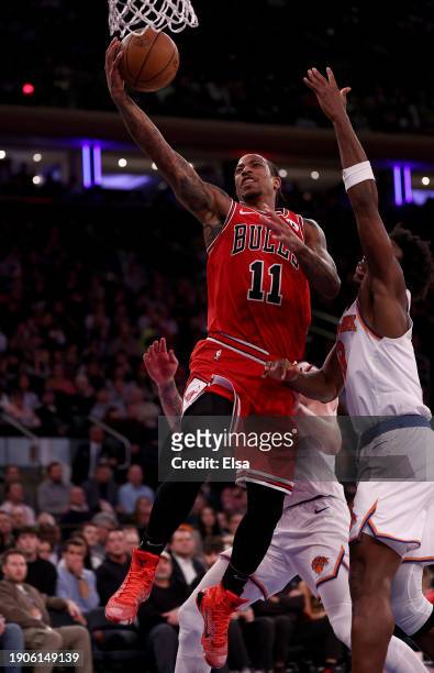 DeMar DeRozan of the Chicago Bulls heads for the net as OG Anunoby of the New York Knicks defends during the second half at Madison Square Garden on...