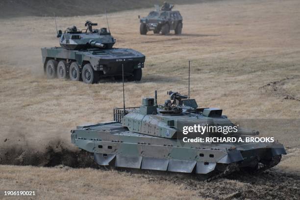 Japanese troops take part in a joint military drill and demonstration conducted by Japan's Ground Self-Defence Force 1st Airborne Brigade with...