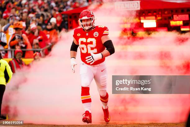 Joe Thuney of the Kansas City Chiefs runs onto the field during player introductions before an NFL football game against the Cincinnati Bengals at...