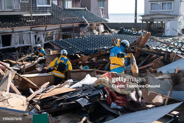 Police officers search for missing persons in the aftermath of an earthquake on New Year's Day on January 04, 2024 in Suzu, Japan. A series of major...