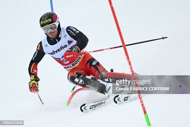 Belgium's Armand Marchant clears a gate in the first run of the Men's Slalom event during the FIS Alpine Ski World Cup event in Adelboden,...