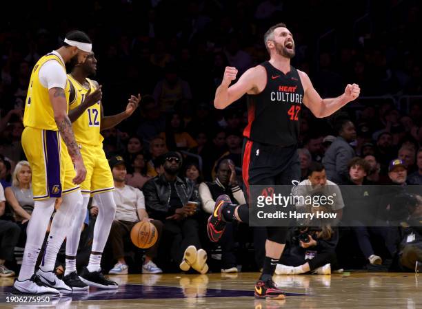 Kevin Love of the Miami Heat celebrates his basket in front of Anthony Davis and Taurean Prince of the Los Angeles Lakers during a 110-96 Heat win...