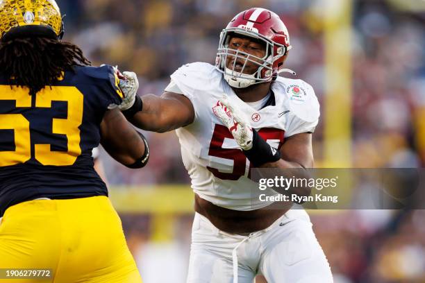 Defensive lineman Tim Smith of the Alabama Crimson Tide rushes the line of scrimmage during the CFP Semifinal Rose Bowl Game against the Michigan...