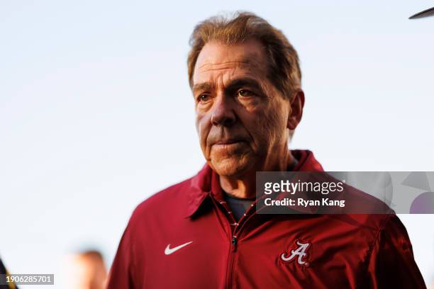 Head coach Nick Saban of the Alabama Crimson Tide runs off the field at halftime during the CFP Semifinal Rose Bowl Game against the Michigan...