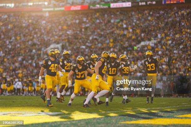 The Michigan Wolverines special teams group celebrates after a kickoff during the CFP Semifinal Rose Bowl Game against the Alabama Crimson Tide at...