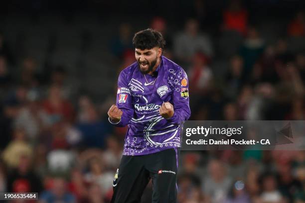Nikhil Chaudhary of the Hurricanes celebrates the dismissal of Quinton de Kock of the Renegades during the BBL match between Melbourne Renegades and...