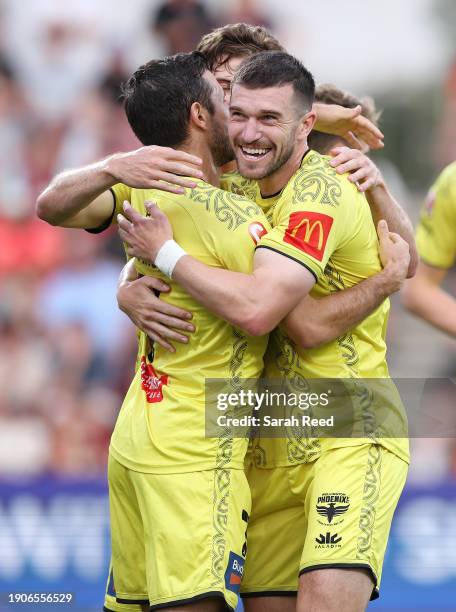 Kosta Barbarouses of Wellington Phoenix is hugged by Tim Payne of Wellington Phoenix after his goal during the A-League Men round 11 match between...