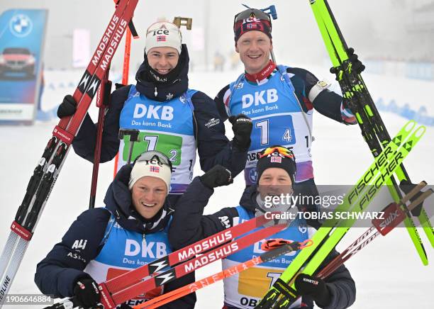 Norway's Sturla Laegreid, Norway's Johannes Thingnes Bo, Norway's Endre Stromsheim and Norway's Tarjei Bo celebrate winning the the men's 4x 7,5km...