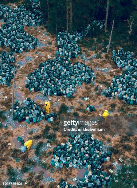 hazmat teams navigate through mountains of waste - miss world stock pictures, royalty-free photos & images