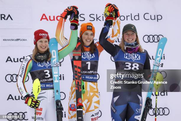 Lena Duerr of Team Germany takes 2nd place, Petra Vlhova of Team Slovakia takes 1st place, A J Hurt of Team United States takes 3rd place during the...