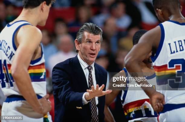 Paul Westhead, Head Coach for the Denver Nuggets points out instructions to Small Forward Marcus Liberty during the NBA Midwest Division basketball...