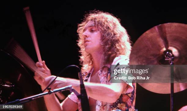 Musician Peter Frampton plays drums as he performs in concert at The Forum, December 7, 1976 in Inglewood, California.