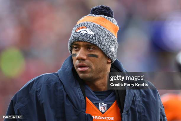 Russell Wilson of the Denver Broncos looks on from the sideline during an NFL football game against the Los Angeles Chargers at Empower Field at Mile...